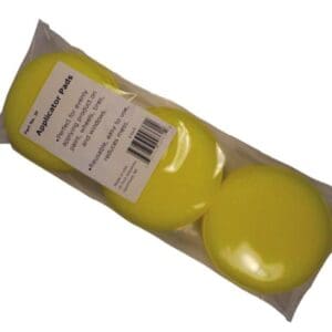 A package of yellow round soap.
