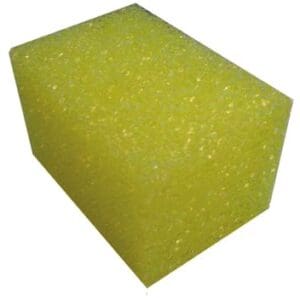 A yellow sponge is sitting on the floor.