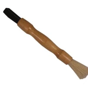 A wooden handle with a brush on top of it.