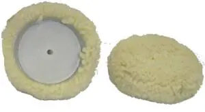 A pair of white wool pads for a car.