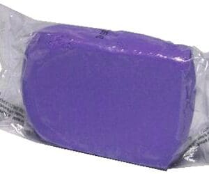 A purple soap sitting on top of a plastic bag.