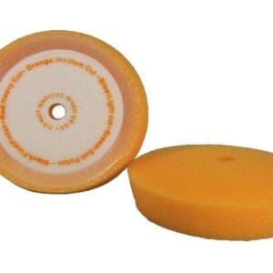 Round orange buffing pads with white center