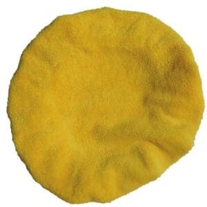 A yellow round towel is sitting on top of the floor.