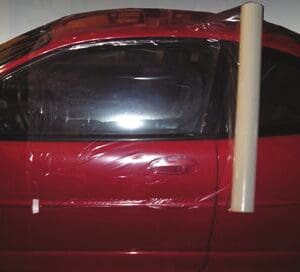 A red car with some white tape on it