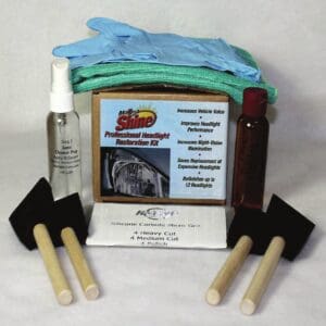 A set of tools and cleaning supplies are sitting on the table.