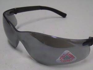 A pair of safety glasses with a sticker on it.