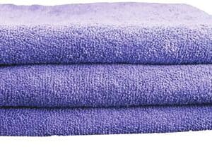 A close up of three towels folded on top of each other